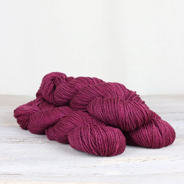 3 skeins of magenta Fibre Co. Acadia yarn. 