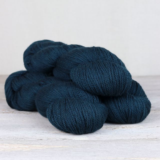 3 skeins of dark teal Fibre Co. Cumbria yarn. 