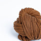 Skein of medium warm brown Brooklyn Tweed Arbor yarn in color Burnished - Hillsborough Yarn Shop - Hillsborough, NC, USA 