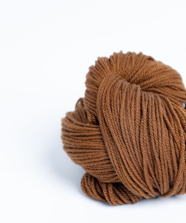 Skein of medium warm brown Brooklyn Tweed Arbor yarn in color Burnished - Hillsborough Yarn Shop - Hillsborough, NC, USA 