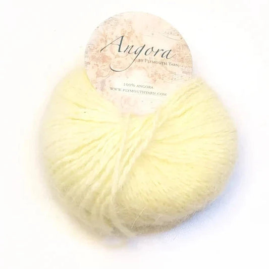 Ball of pastel yellow Plymouth Angora yarn. 