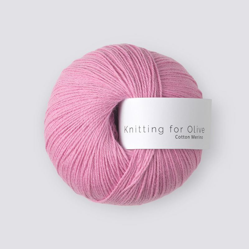 Pink skein of yarn with 'Knitting for Olive' label on a light gray background