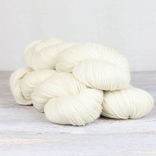 3 skeins of natural white Fibre Co. Cumbria yarn. 