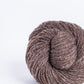 Medium brown ball of Brooklyn Tweed Loft yarn. 