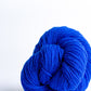 Bright cobalt ball of Brooklyn Tweed Loft yarn. 