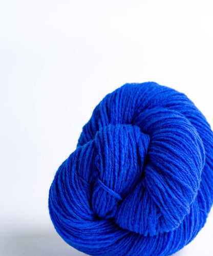 Bright cobalt ball of Brooklyn Tweed Loft yarn. 