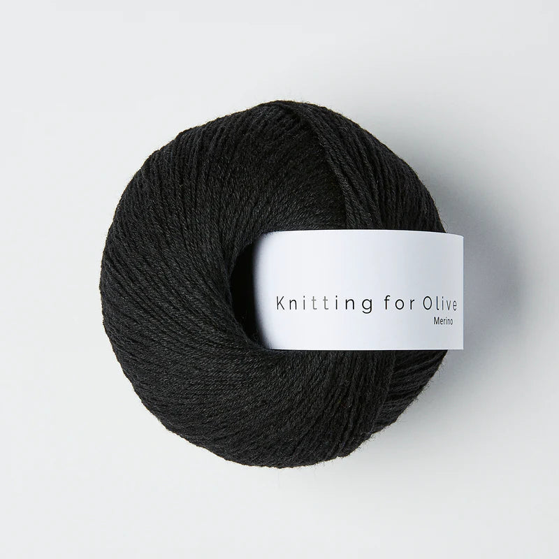 Black skein of yarn with a 'Knitting for Olive' label on a white background