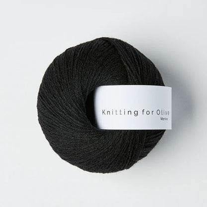 Black skein of yarn with a 'Knitting for Olive' label on a white background