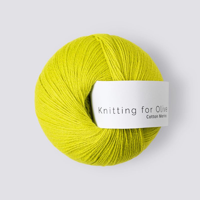 Yellow skein of yarn with a label on a white background