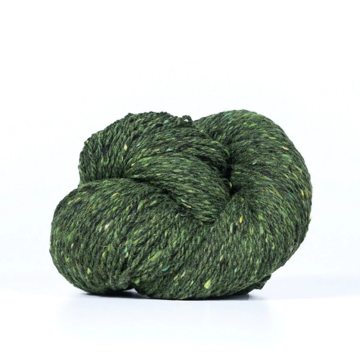 Skein of forest green Kelbourne Woolens Lucky Tweed yarn. 