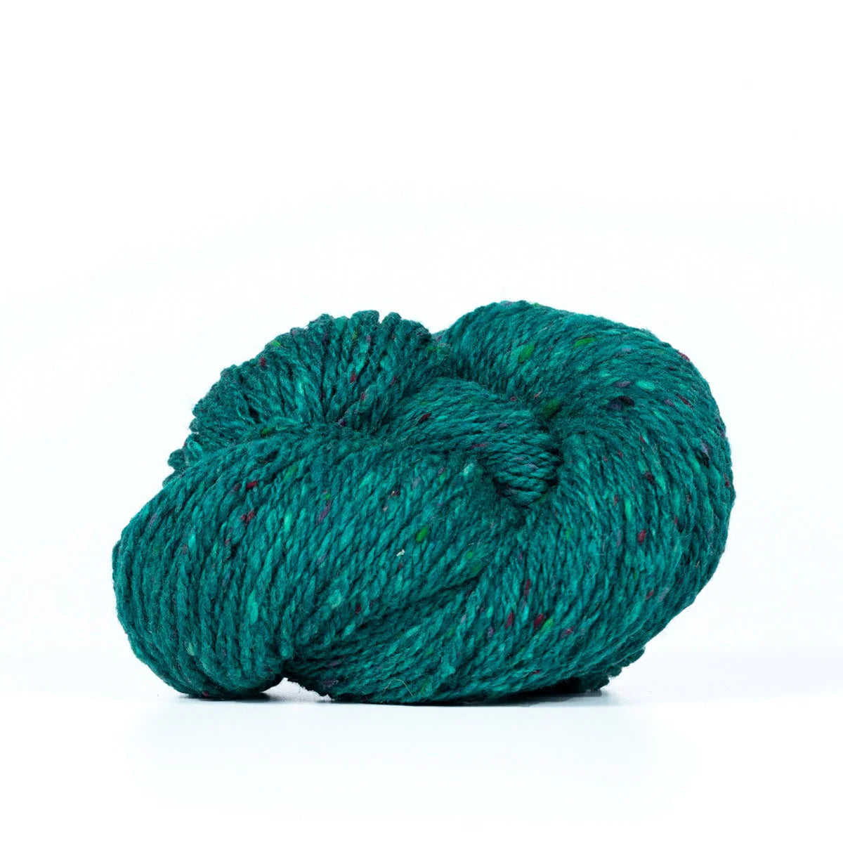 Skein of teal green Kelbourne Woolens Lucky Tweed yarn. 