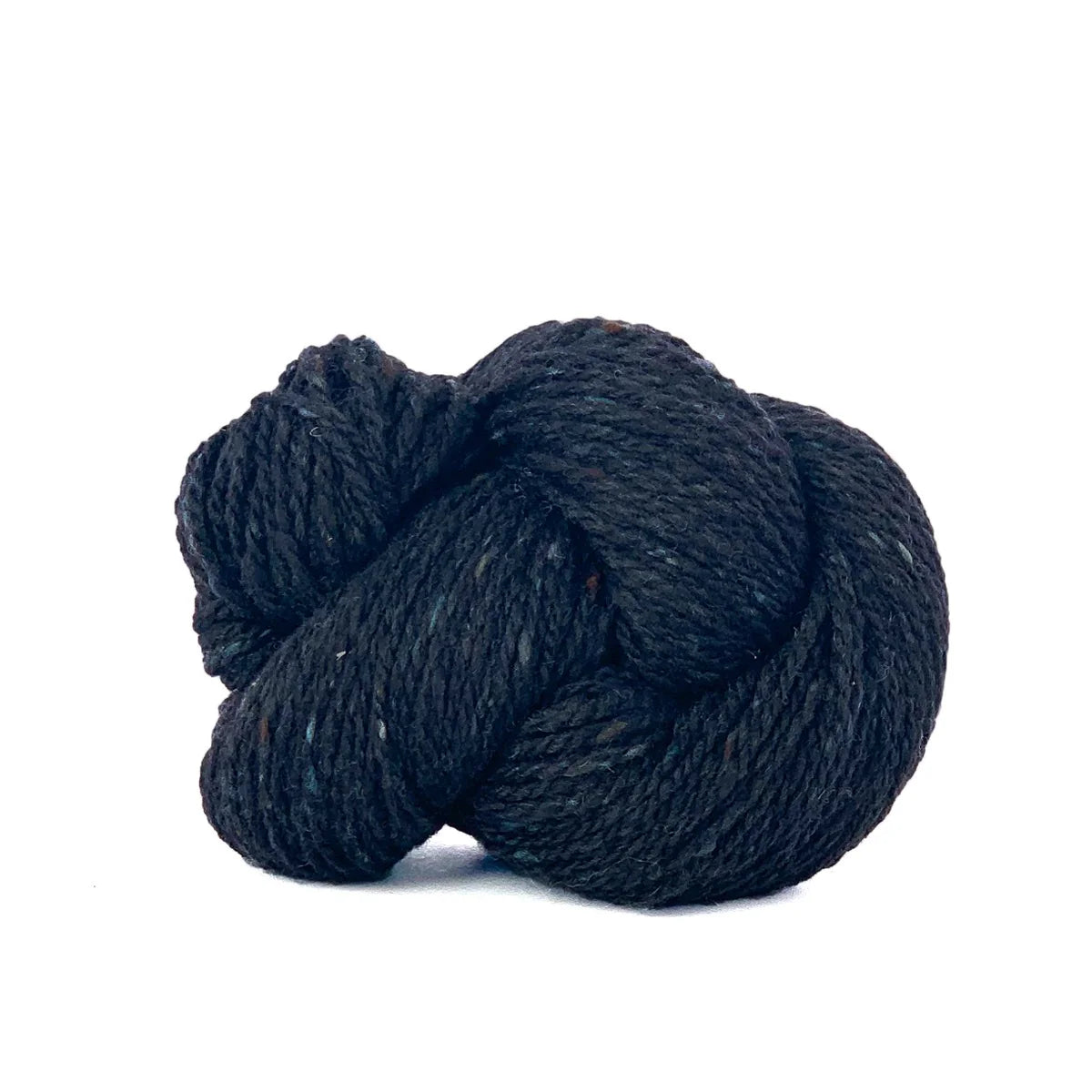 Skein of blue black Kelbourne Woolens Lucky Tweed yarn. 