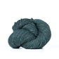 Skein of deep teal Kelbourne Woolens Lucky Tweed yarn. 