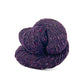 Skein of raisin purple Kelbourne Woolens Lucky Tweed yarn. 