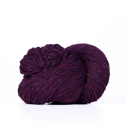 Skein of purplish burgundy Kelbourne Woolens Lucky Tweed yarn. 