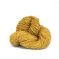 Skein of golden yellow Kelbourne Woolens Lucky Tweed yarn. 