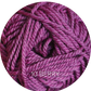 Close up on a magenta ball of Ewe Ewe Heather’s Heathers yarn. 