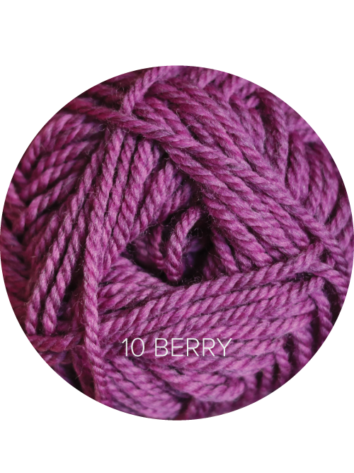 Close up on a magenta ball of Ewe Ewe Heather’s Heathers yarn. 