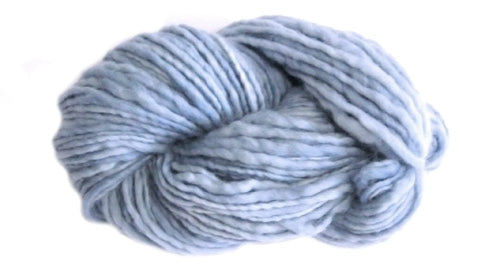 Light blue skein of Manos del Uruguay Wool Clásica yarn. 