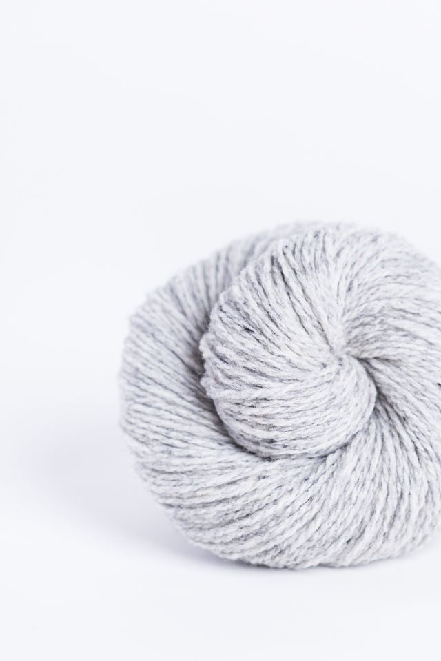 Light heathered gray ball of Brooklyn Tweed Loft yarn. 