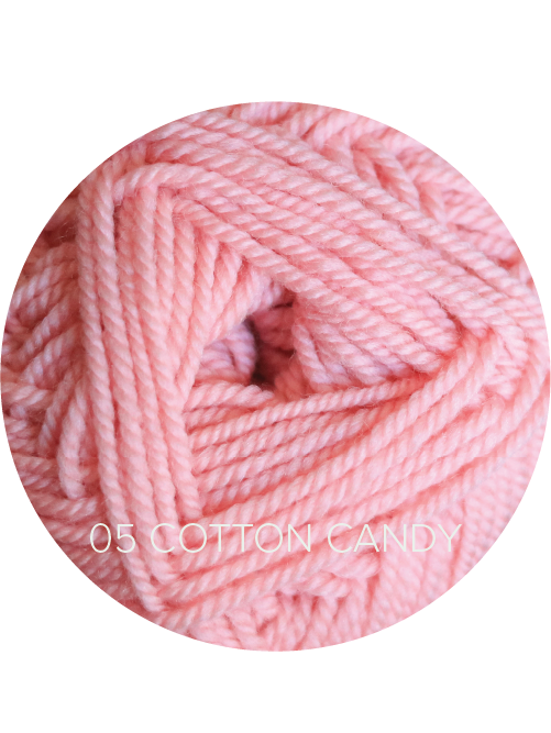 Close up on a light pink ball of Ewe So Sporty yarn. 