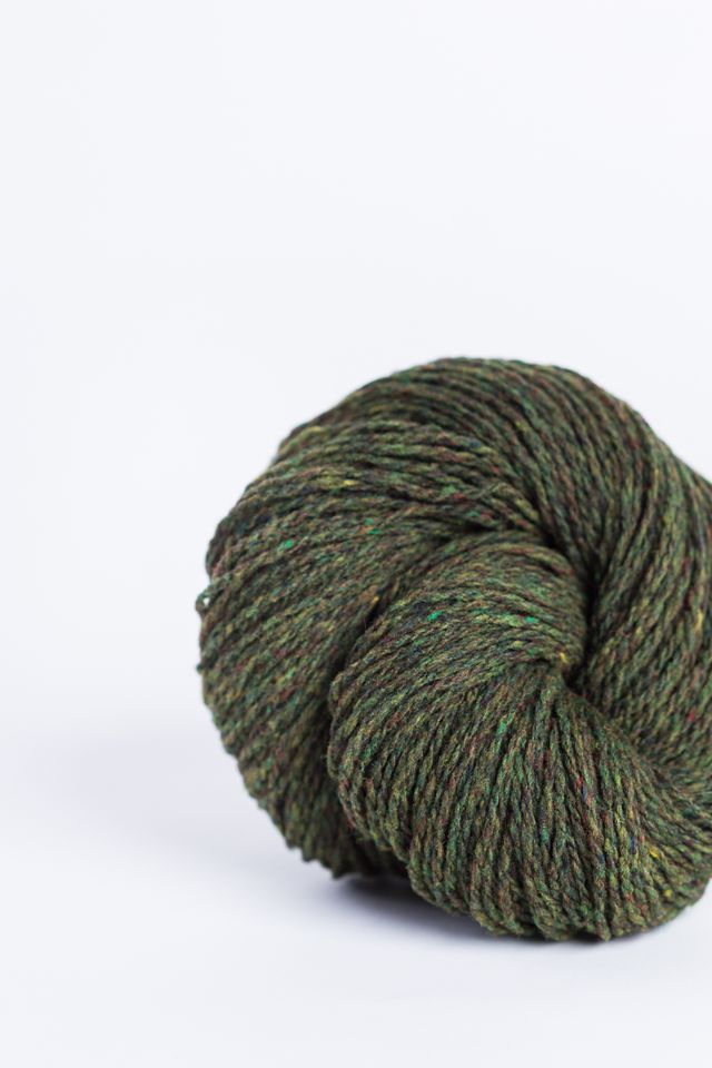 Olive green ball of Brooklyn Tweed Loft yarn. 