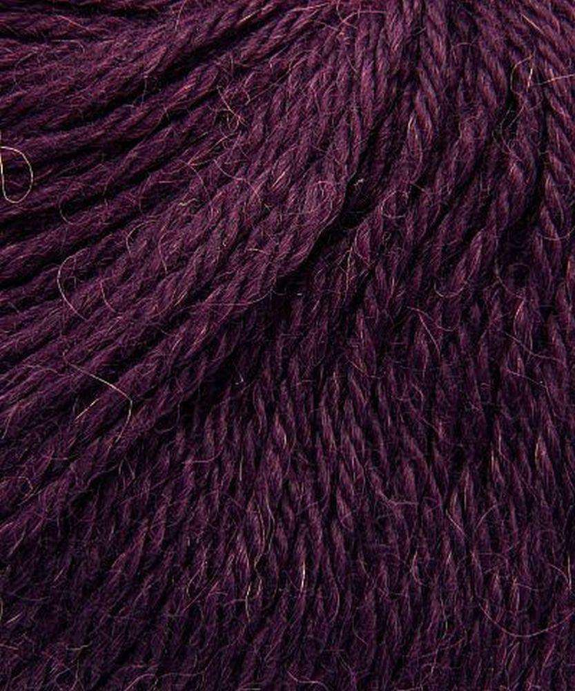 Close up on a dark purple ball of Plymouth Baby Alpaca DK yarn.