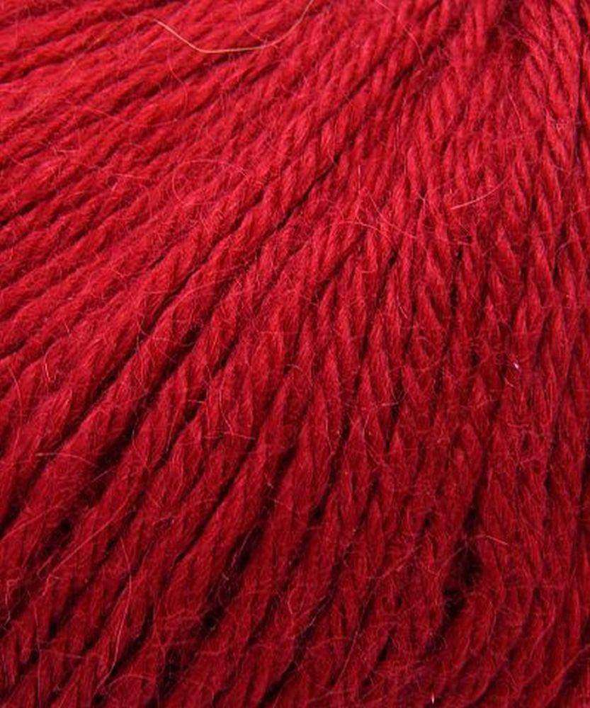 Close up on a bright red ball of Plymouth Baby Alpaca DK yarn.