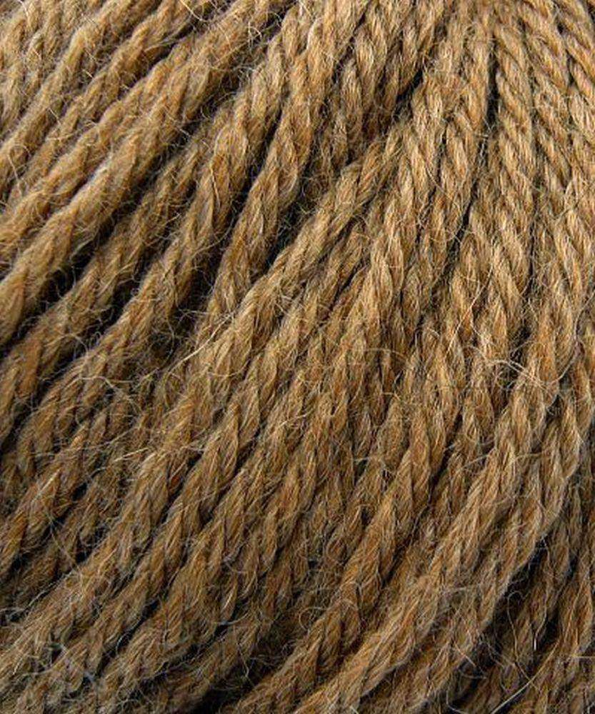 Close up on a brown ball of Plymouth Baby Alpaca DK yarn.