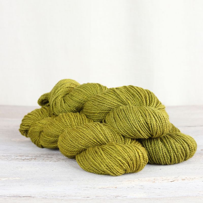 3 skeins of chartreuse Fibre Co. Acadia yarn. 