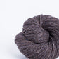 Dark heathered brown ball of Brooklyn Tweed Loft yarn. 