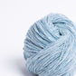 Ice blue ball of Brooklyn Tweed Loft yarn. 