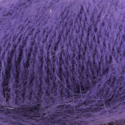 Close up on ball of bright purple Plymouth Angora yarn. 