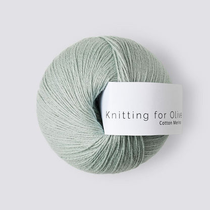 Ball of yarn with 'Knitting for Olive' label on a light gray background