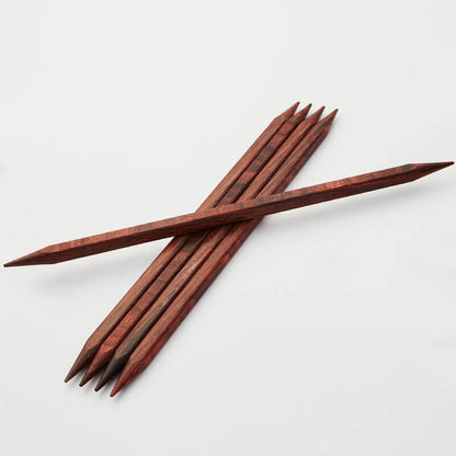 Set of 5 brown cubics double pointed needles. 