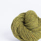 Acid green ball of Brooklyn Tweed Loft yarn. 