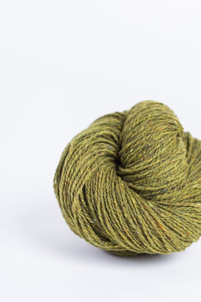 Acid green ball of Brooklyn Tweed Loft yarn. 