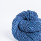 Denim blue ball of Brooklyn Tweed Loft yarn. 