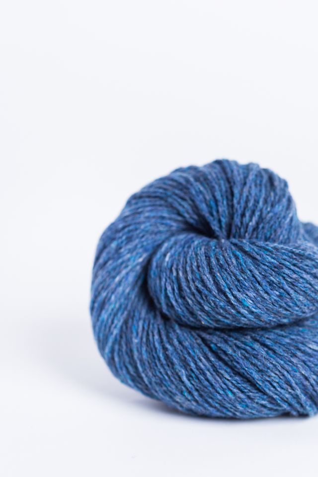 Denim blue ball of Brooklyn Tweed Loft yarn. 