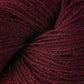 Close up on maroon skein of Berroco Ultra Alpaca yarn.