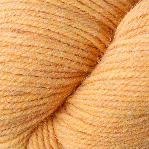 Close up on yellow orange skein of Berroco Ultra Alpaca yarn.