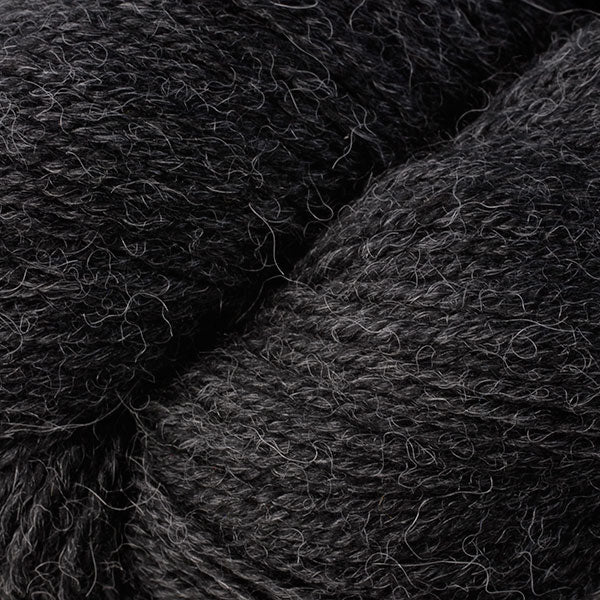 Close up on dark charcoal skein of Berroco Ultra Alpaca yarn.