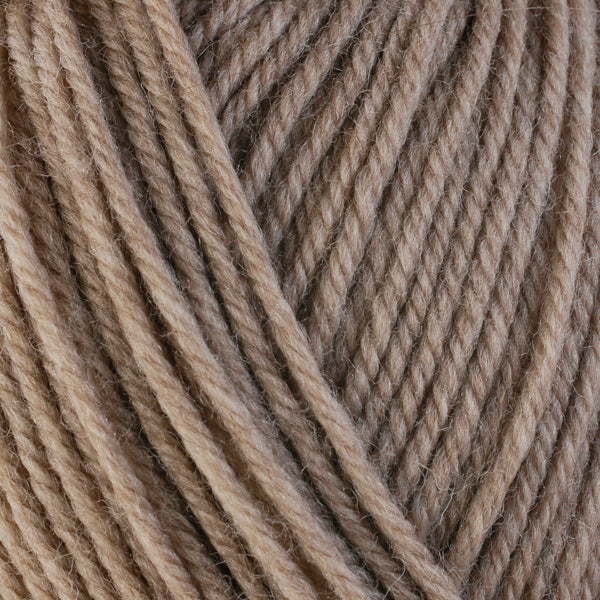 Close up on medium brown ball of Berroco Ultra Wool yarn.