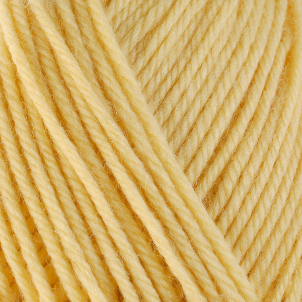 Close up on light yellow ball of Berroco Ultra Wool yarn.