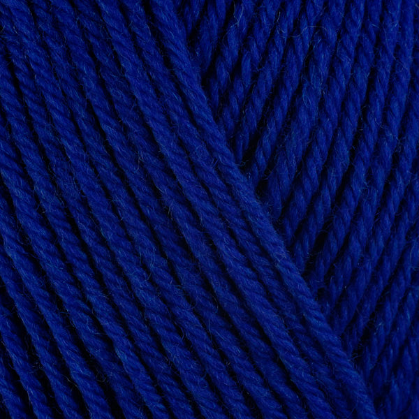 Close up on cobalt blue ball of Berroco Ultra Wool yarn.