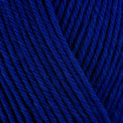 Close up on cobalt blue ball of Berroco Ultra Wool yarn.