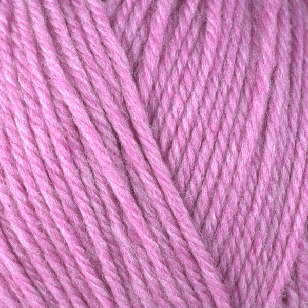 Close up on pink ball of Berroco Ultra Wool yarn.