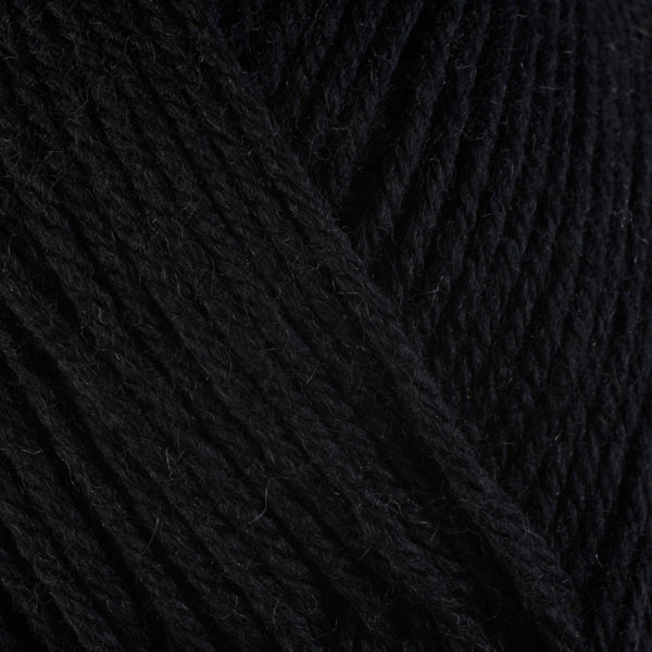 Close up on black ball of Berroco Ultra Wool yarn.