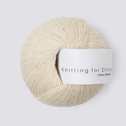 Ball of undyed yarn with 'Knitting for Olive' label on a white background