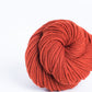 Skein of dark brick red orange Brooklyn Tweed Arbor yarn in color Butte - Hillsborough Yarn Shop - Hillsborough, NC, USA